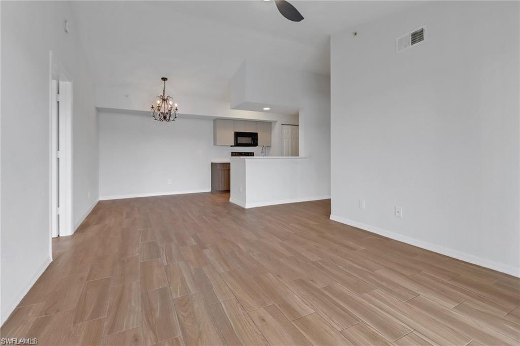 4720 St Croix Lane, Unit 135 Naples, FL 34109 - Photo 11 of 24 a view of empty room with wooden floor