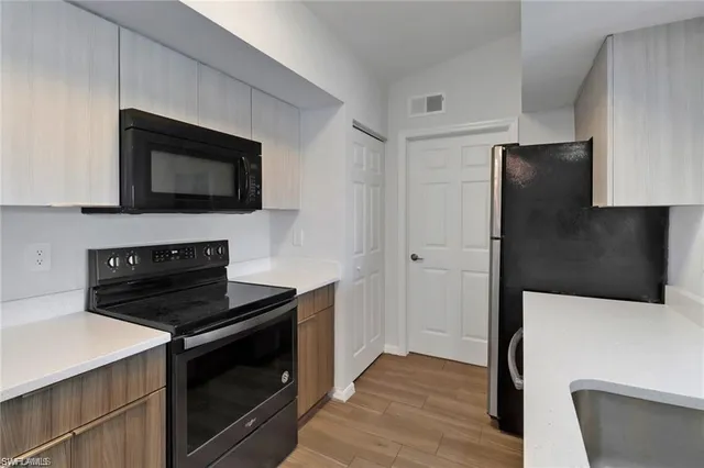 a kitchen with a stove and a microwave