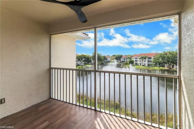 a view of a balcony with furniture