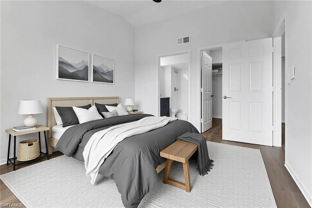 4720 St Croix Lane, Unit 135 Naples, FL 34109 - Photo 3 of 24 a bedroom with a bed and a night stand