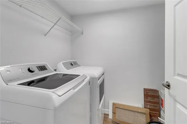 a utility room with dryer and washer