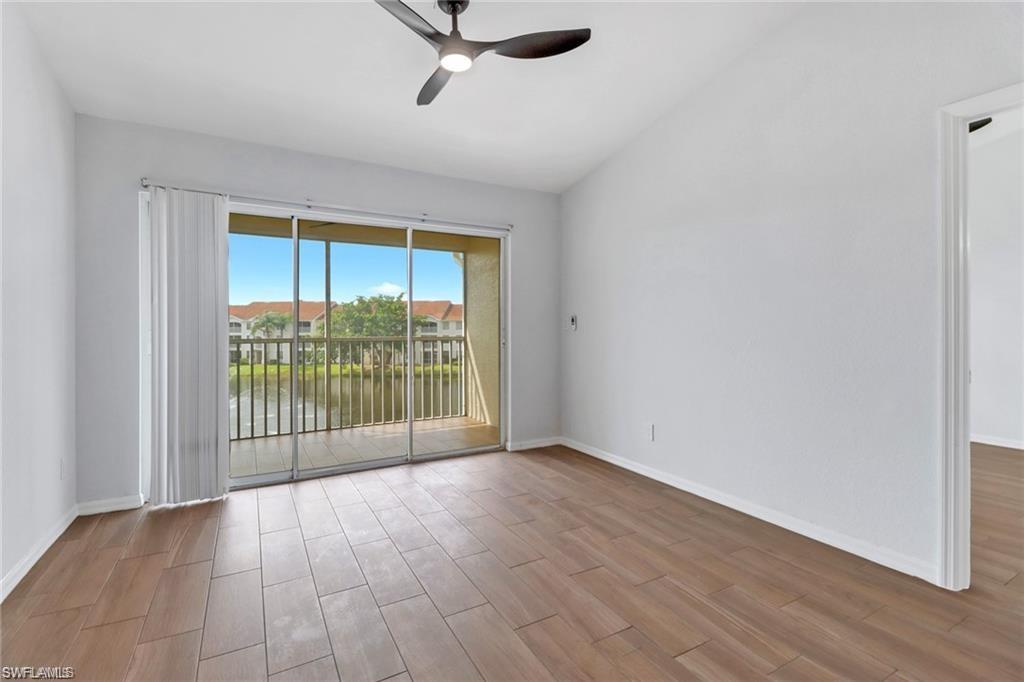4720 St Croix Lane, Unit 135 Naples, FL 34109 - Photo 10 of 24 a view of a room with wooden floor and windows