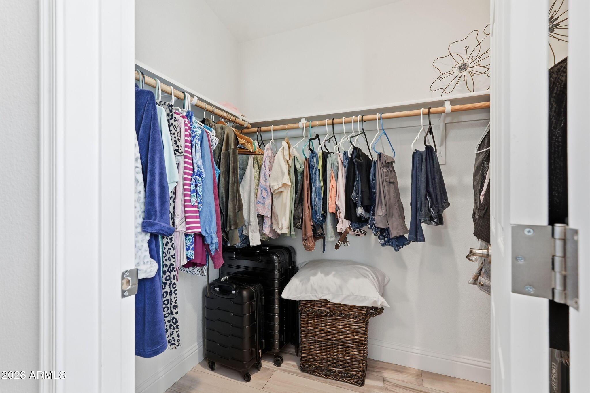 8865 East Baseline Road, Unit 1417 Mesa, AZ 85209 - Photo 22 of 47 a view of walk in closet with clothes