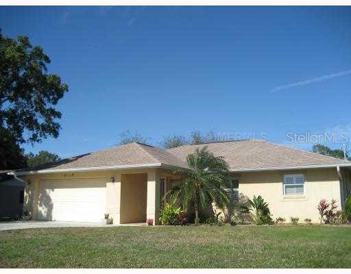 723 Beverly Road Venice, FL 34293 - Photo 1 of 1 a view of a white house with a yard and plants