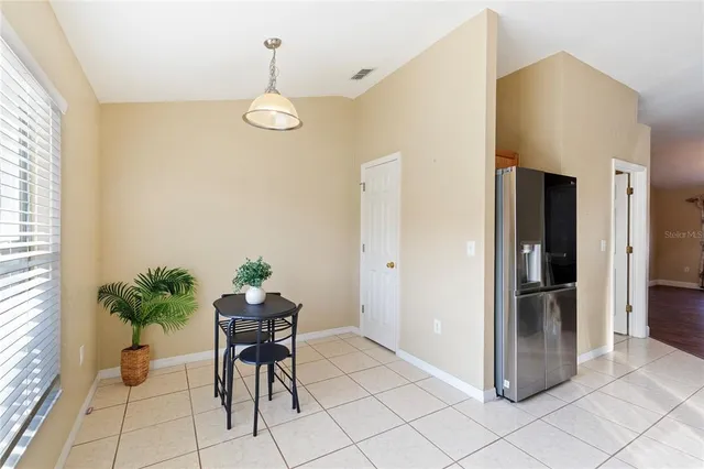 a view of a workspace area with furniture and wooden floor
