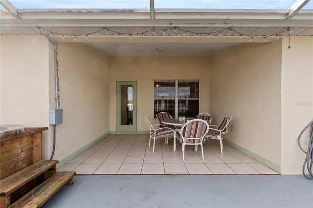 a view of a livingroom with furniture and a window