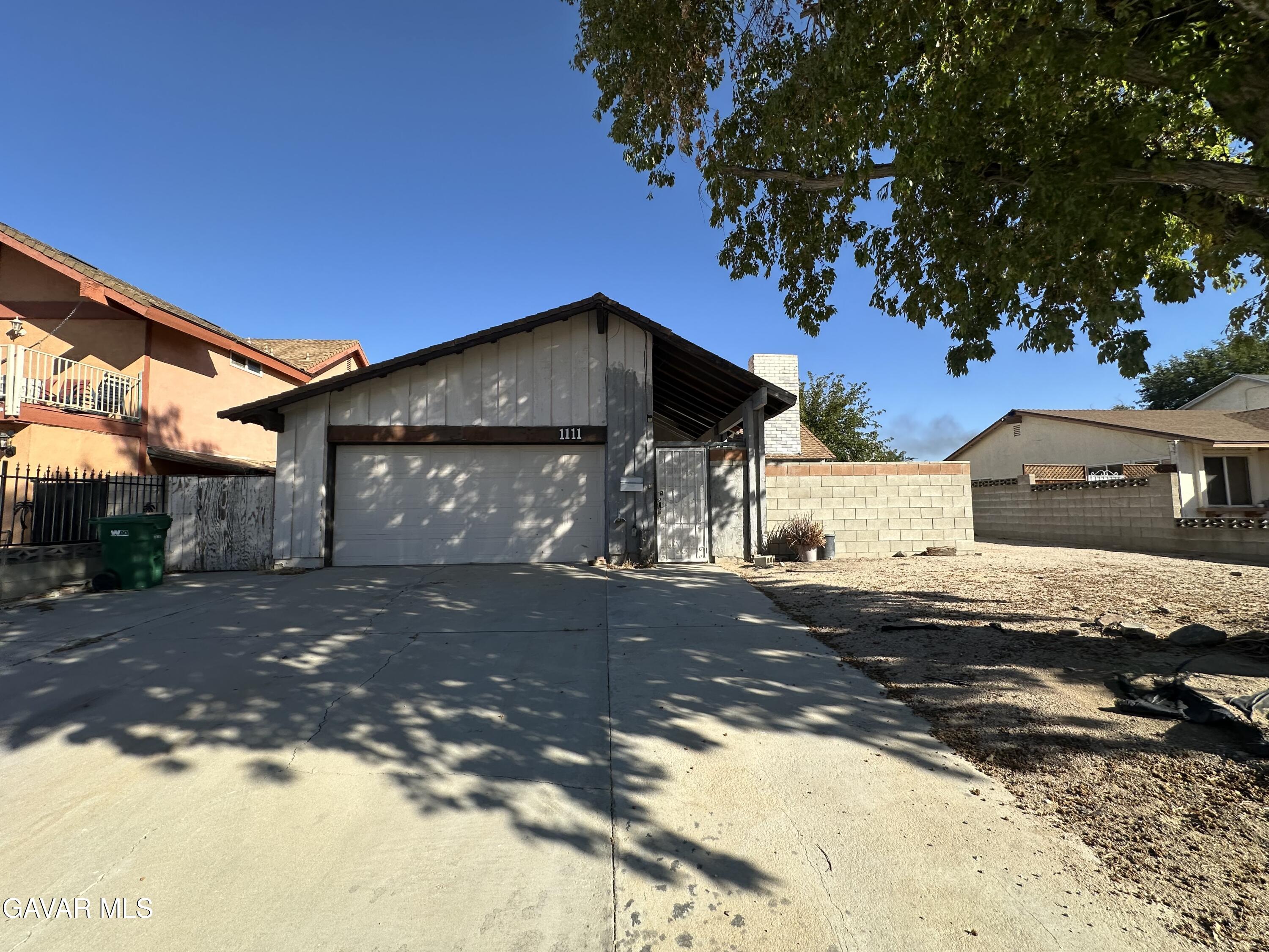 1111 Caperton Street Lancaster, CA 93535 - Photo 1 of 49 a front view of a house with a yard