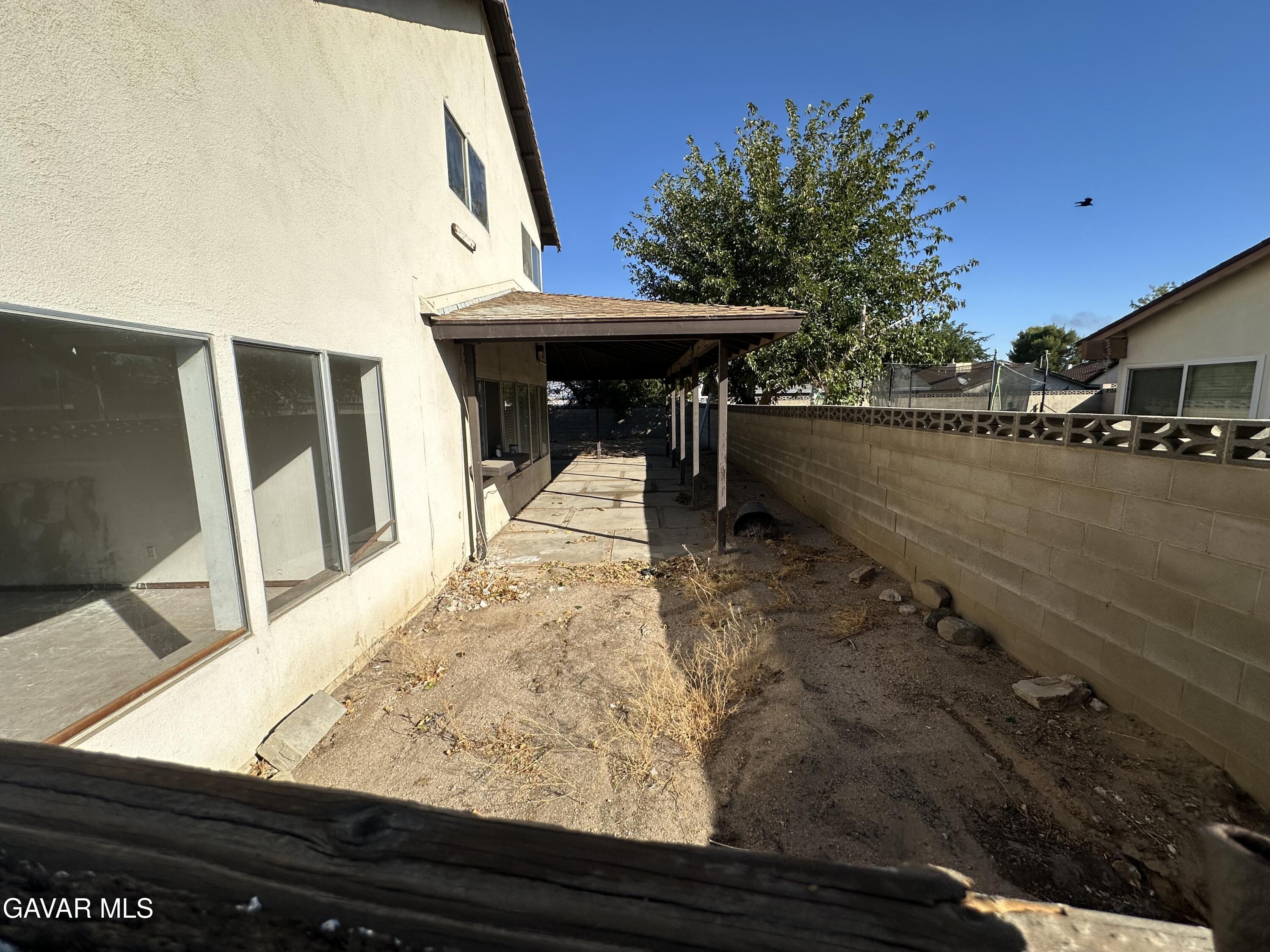 1111 Caperton Street Lancaster, CA 93535 - Photo 17 of 49 a view of swimming pool with outdoor seating