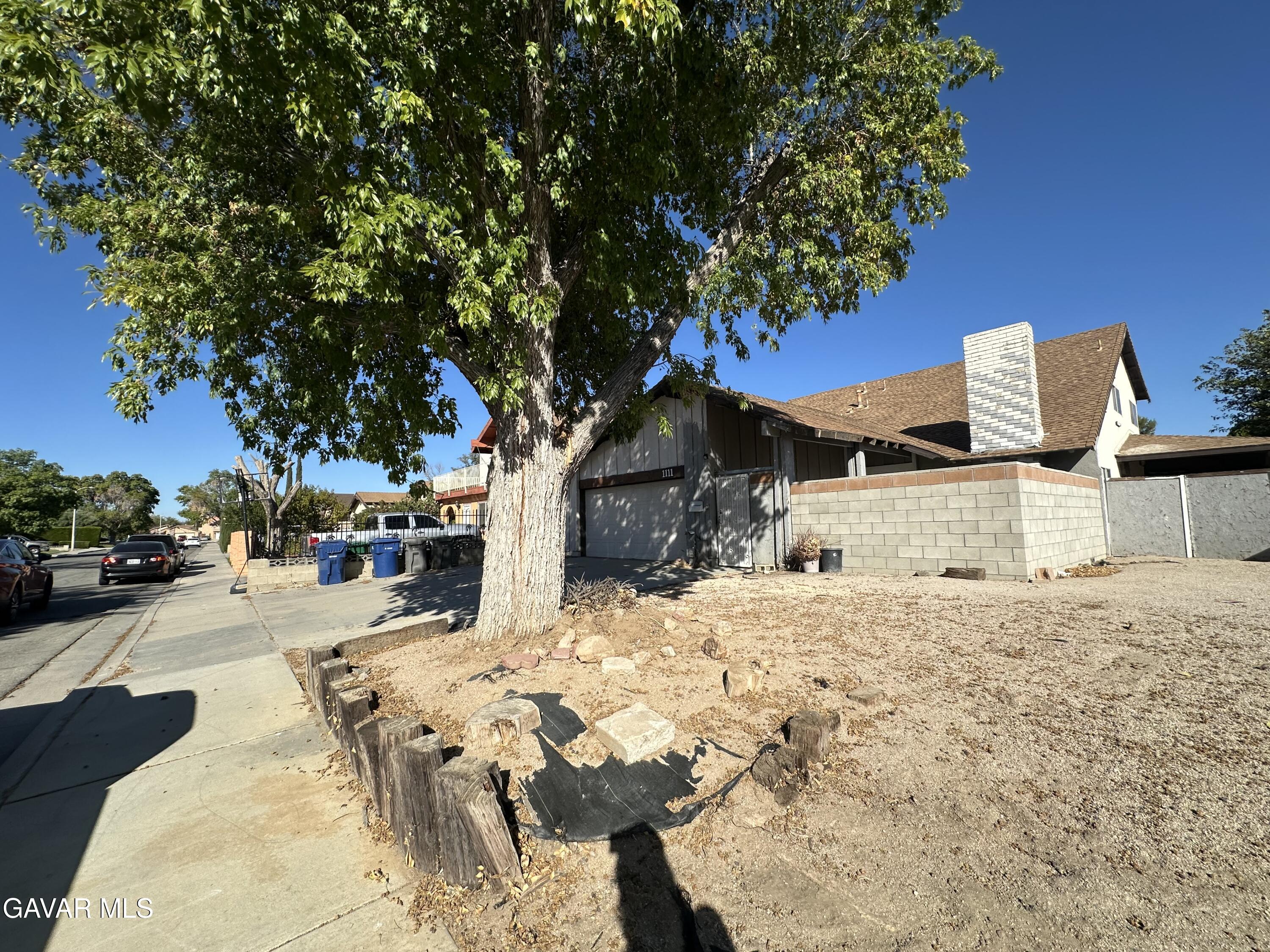 1111 Caperton Street Lancaster, CA 93535 - Photo 2 of 49 a view of a backyard of the house