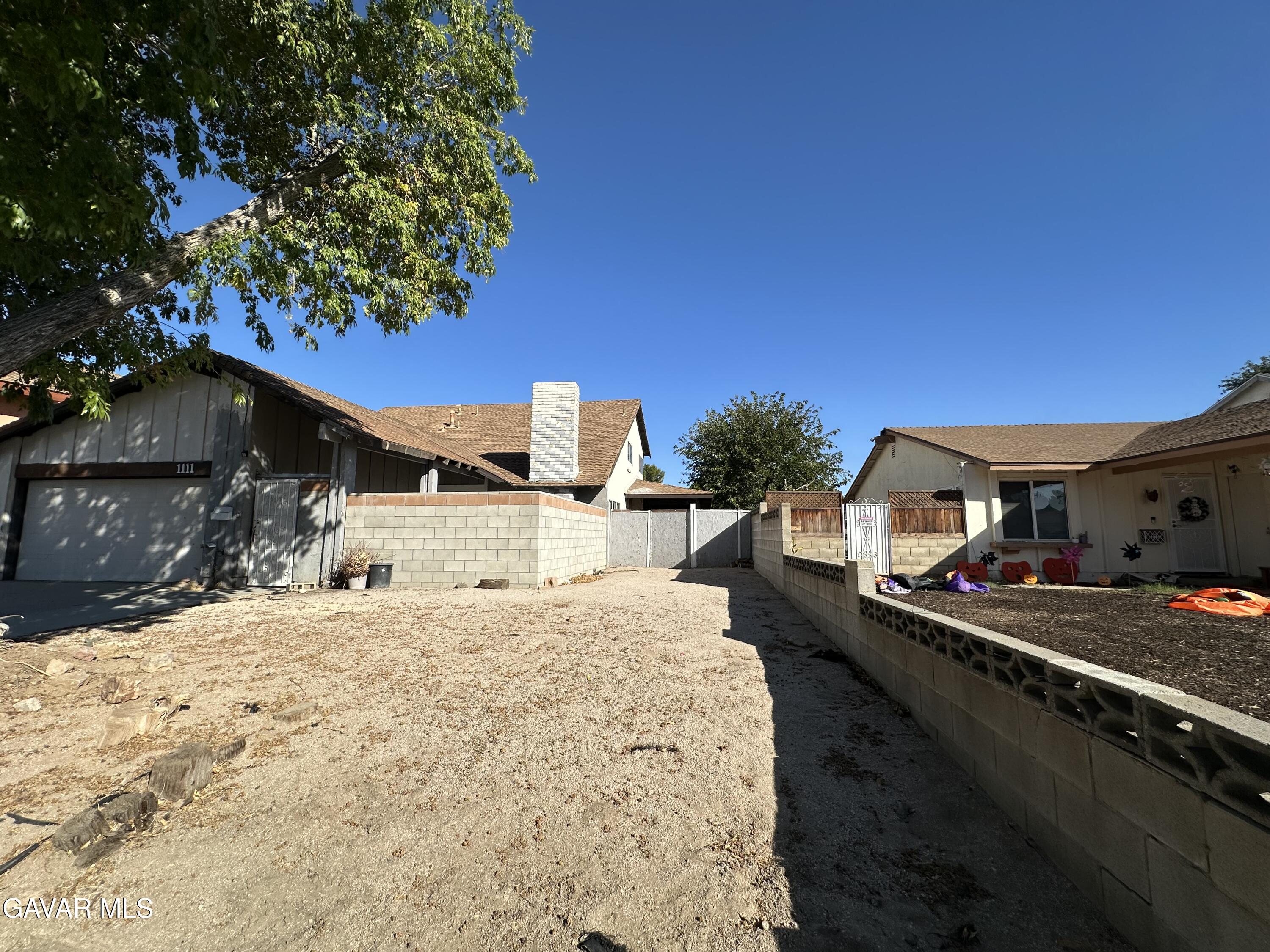 1111 Caperton Street Lancaster, CA 93535 - Photo 3 of 49 a large parking space in the middle of a building