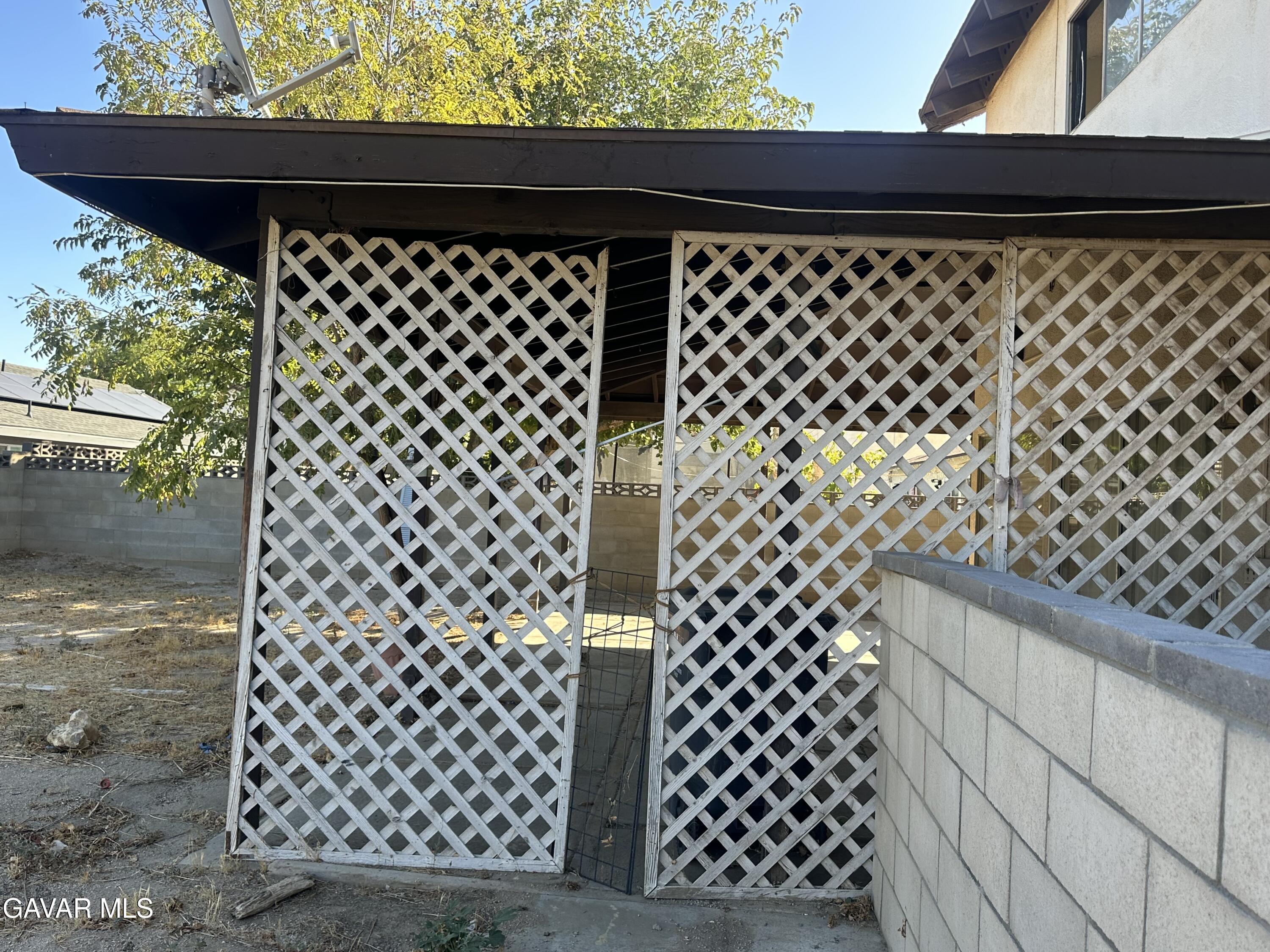 1111 Caperton Street Lancaster, CA 93535 - Photo 32 of 49 a close view of a black gate