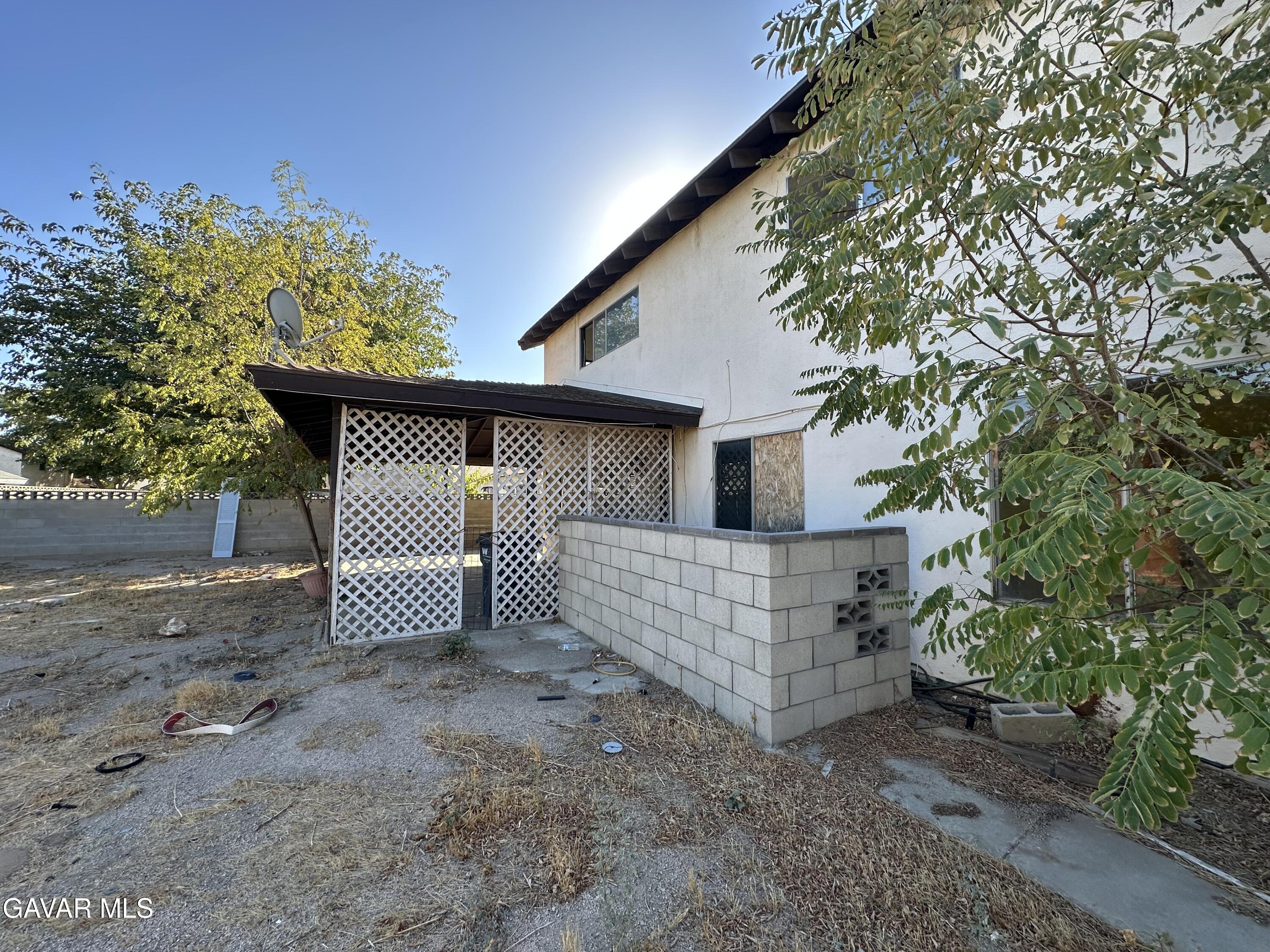 1111 Caperton Street Lancaster, CA 93535 - Photo 36 of 49 a view of a house with a yard and garage