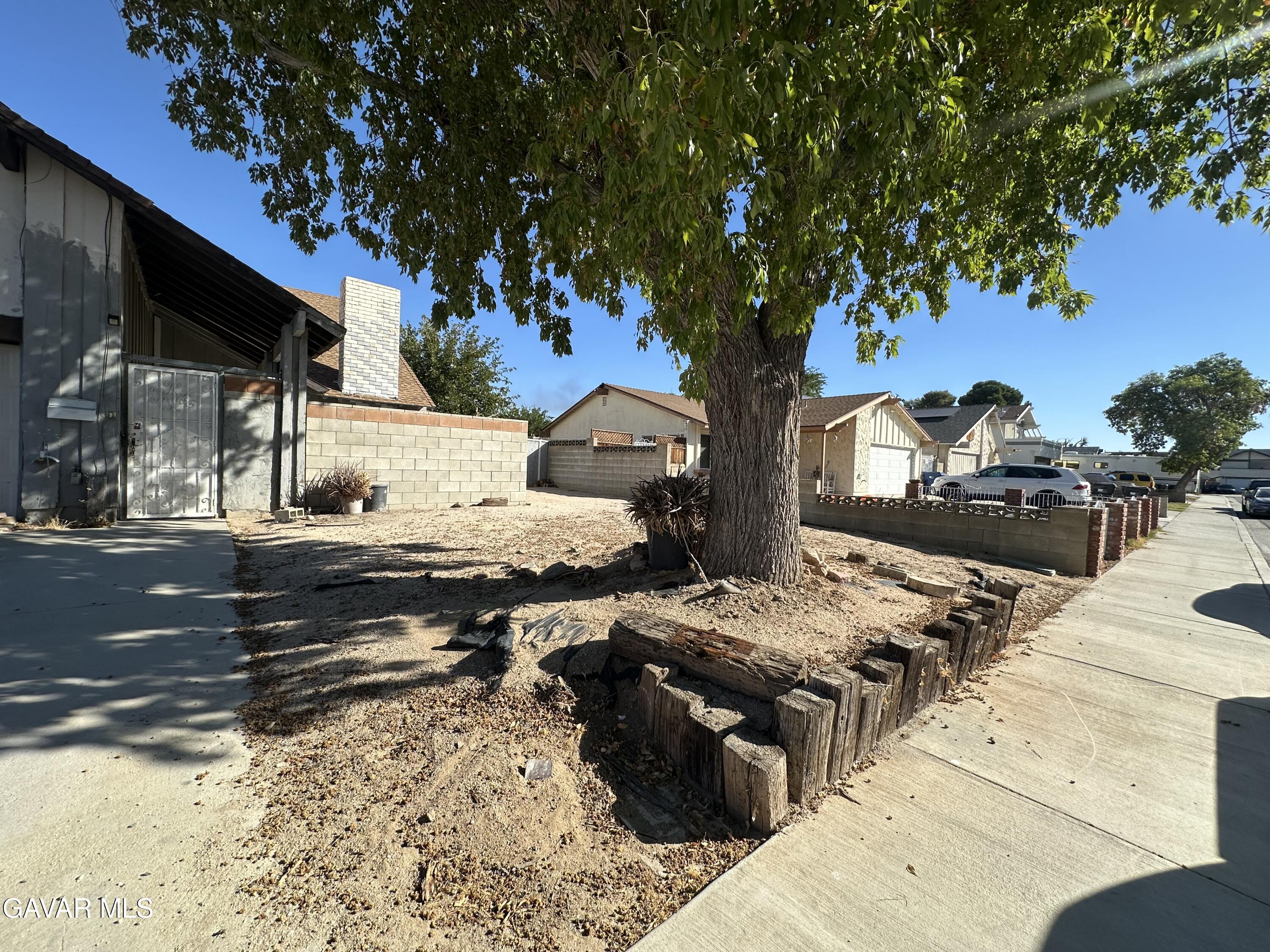 1111 Caperton Street Lancaster, CA 93535 - Photo 5 of 49 a view of a backyard of the house