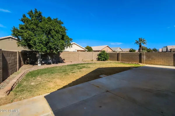 a view of yard with swimming pool and trees