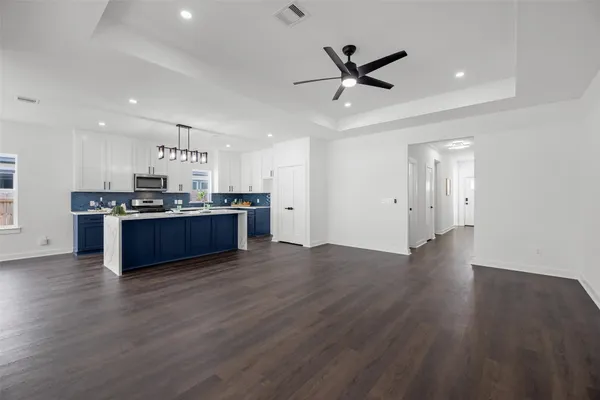 a view of kitchen with wooden floor and window