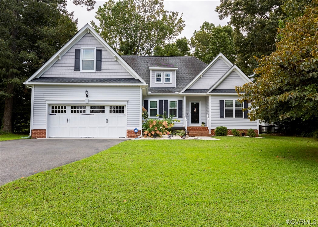 a front view of a house with a yard and porch