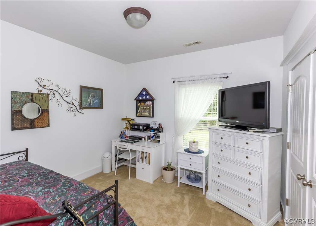 337 Shelton Place Aylett, VA 23009 - Photo 24 of 34 a bedroom with a bed and a flat screen tv