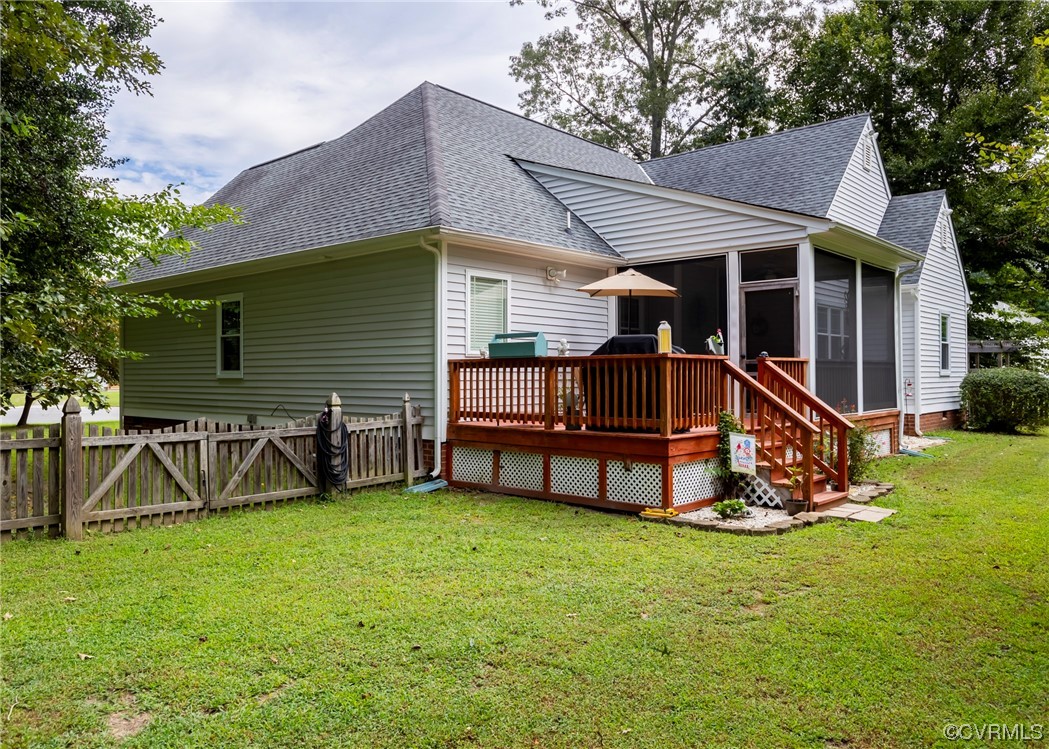 337 Shelton Place Aylett, VA 23009 - Photo 7 of 34 a view of a house with a yard and a wooden deck