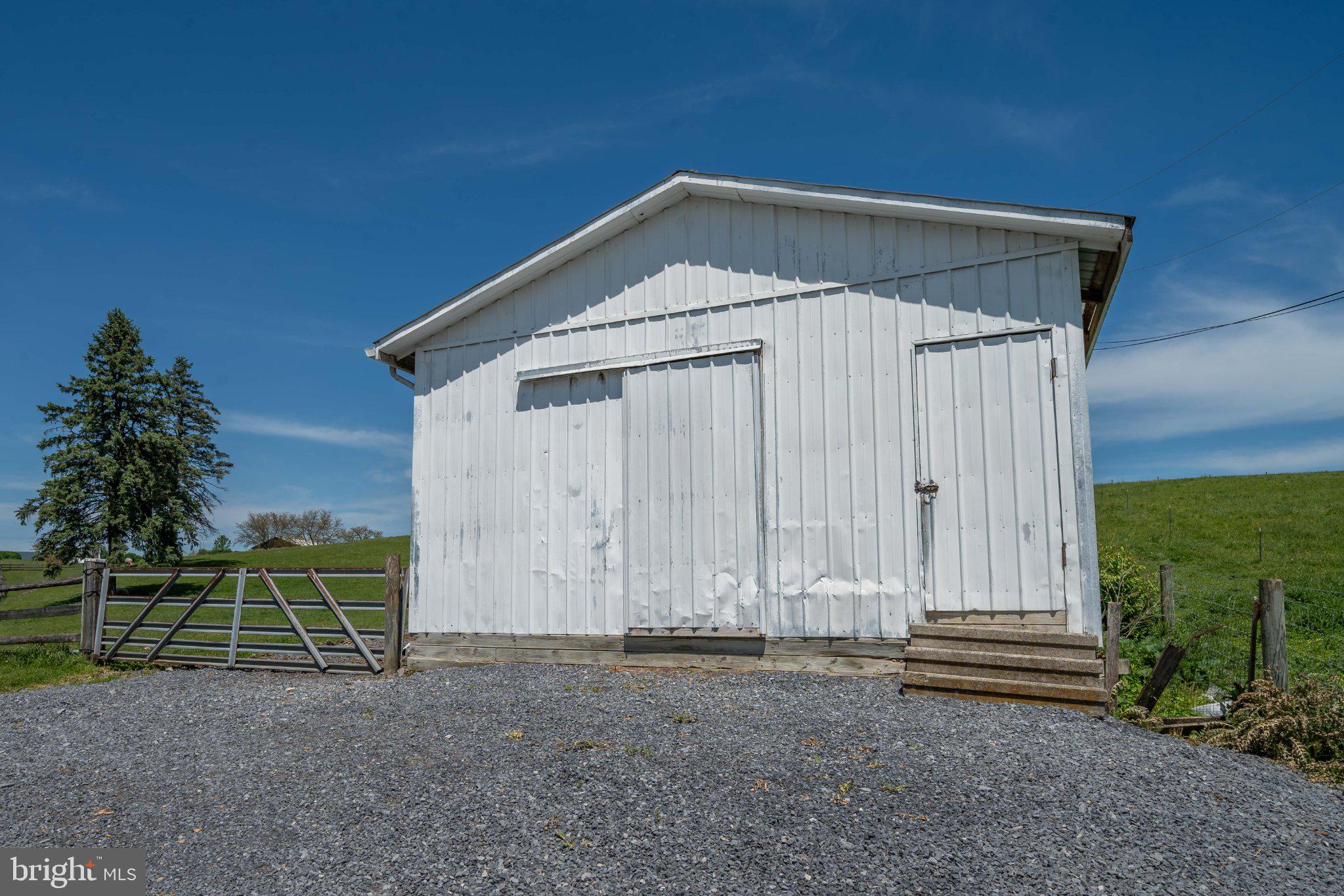 340 Applehouse Road Belleville, PA 17004 - Photo 16 of 76 Charming rustic barn under blue skies.