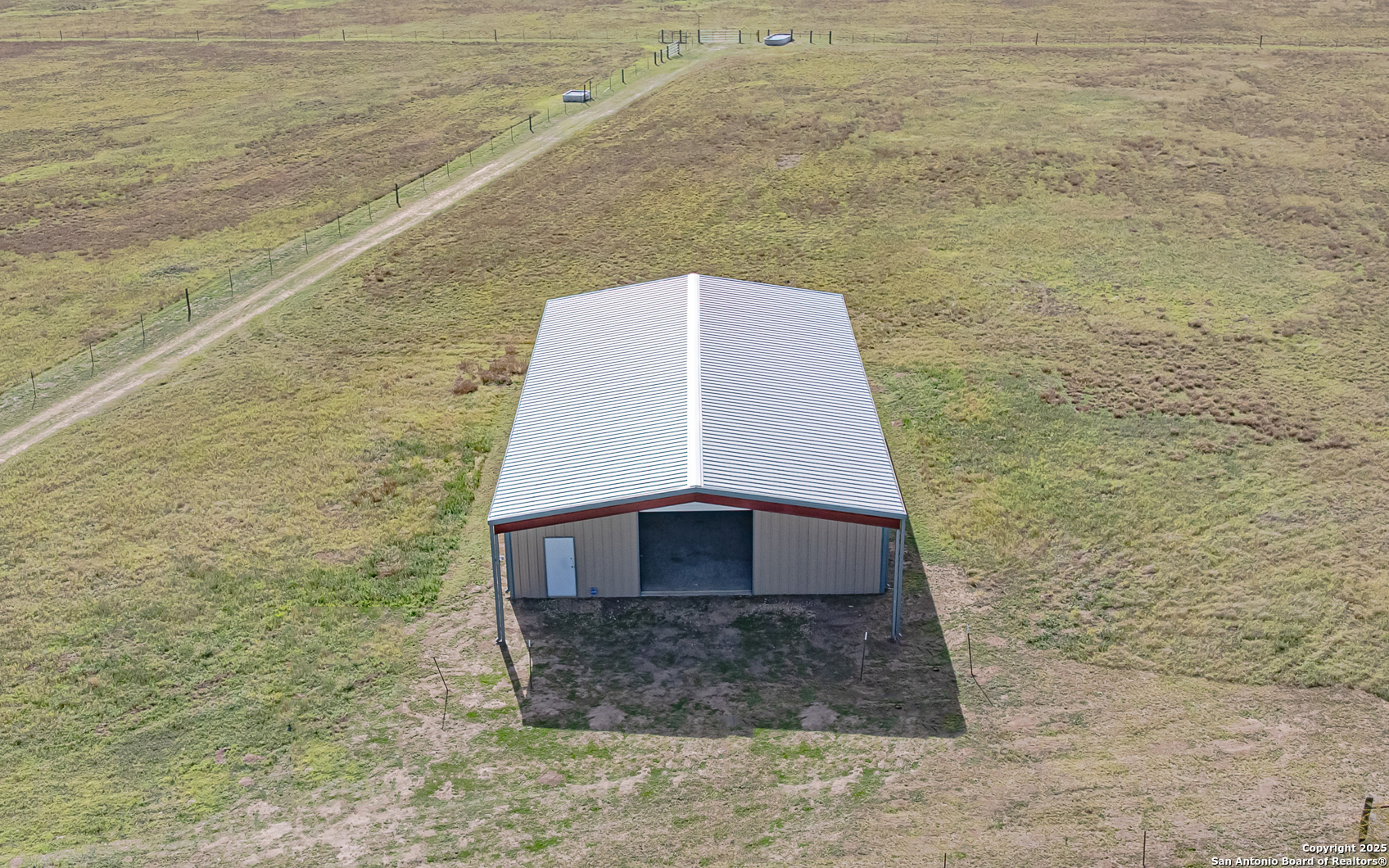 1061 County Road 156 Kenedy, TX 78119 - Photo 11 of 34 a brick house with a hallway