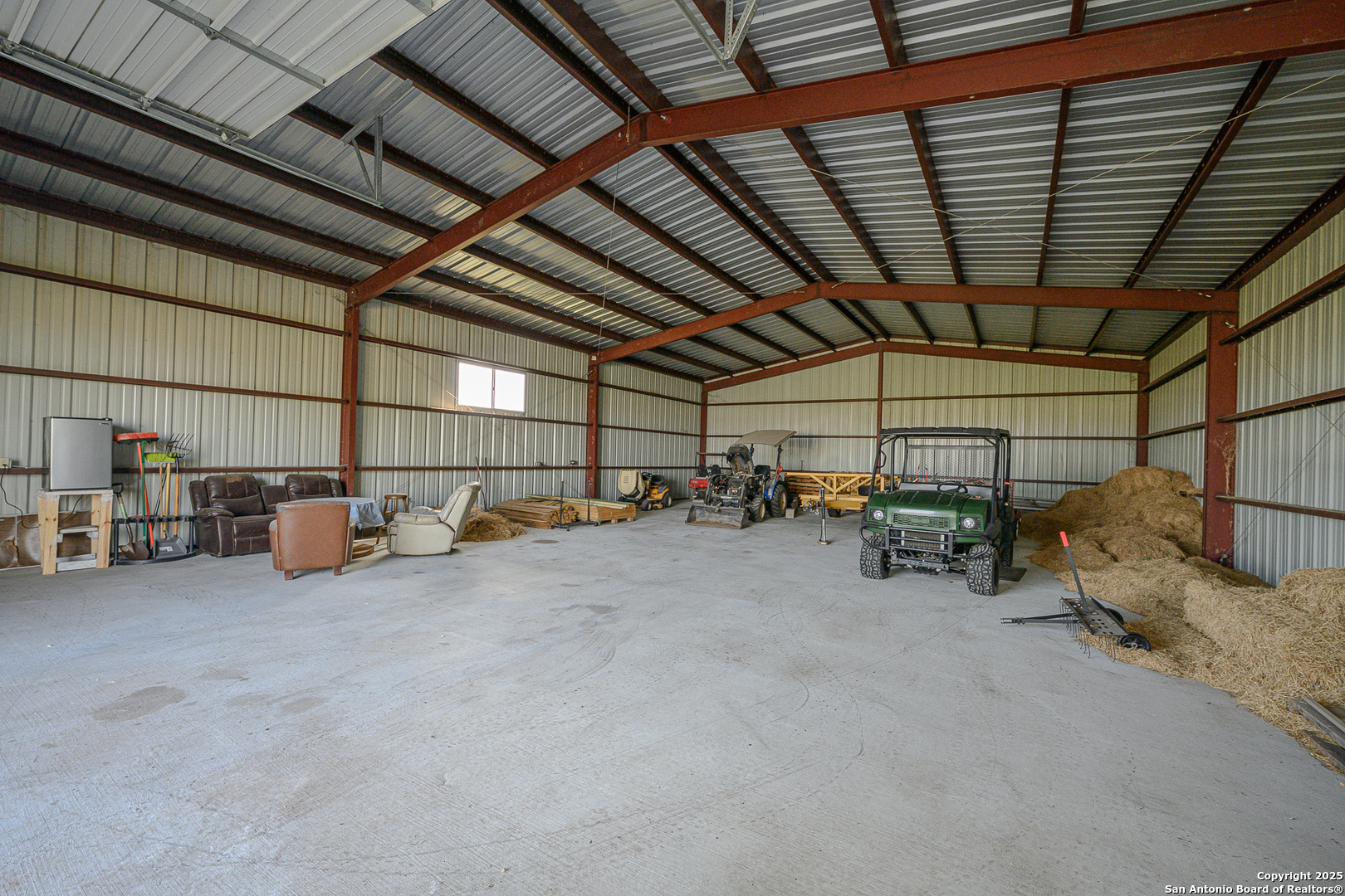 1061 County Road 156 Kenedy, TX 78119 - Photo 23 of 34 a view of parking garage with cars