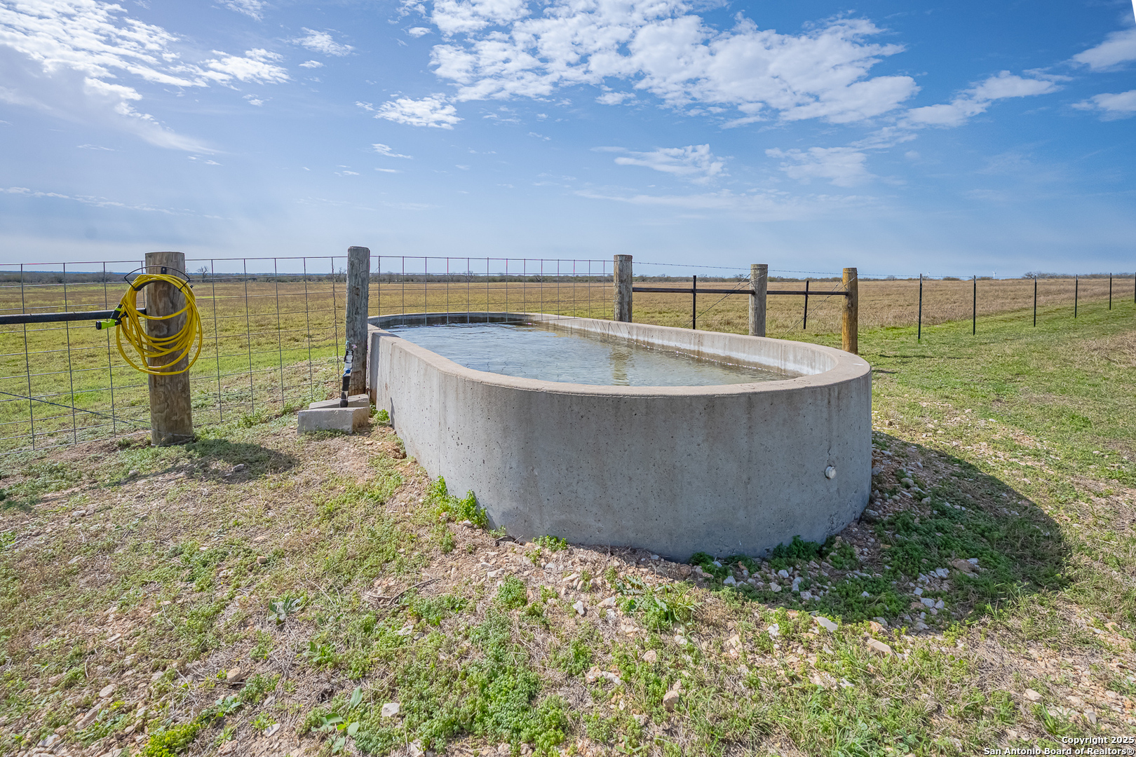 1061 County Road 156 Kenedy, TX 78119 - Photo 29 of 34 a view of a swimming pool with a yard
