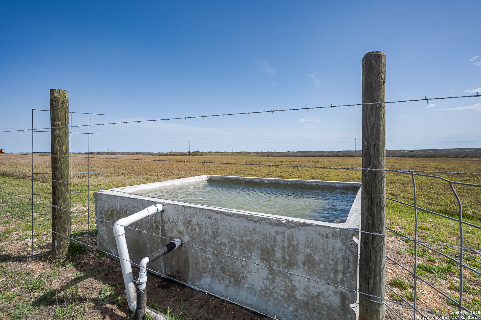 1061 County Road 156 Kenedy, TX 78119 - Photo 32 of 34 a view of a balcony with floor to ceiling window and an ocean view