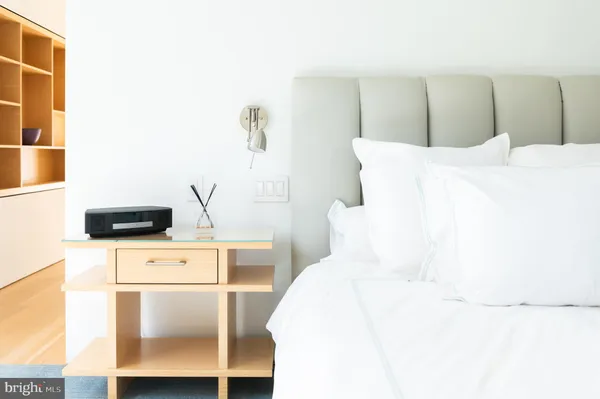 a bedroom with a bed and a cabinets