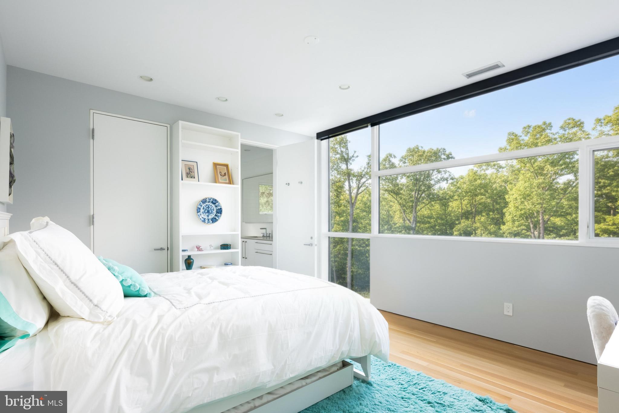 9119 Levelle Drive Chevy Chase, MD 20815 - Photo 24 of 48 a bedroom with a bed and a large window