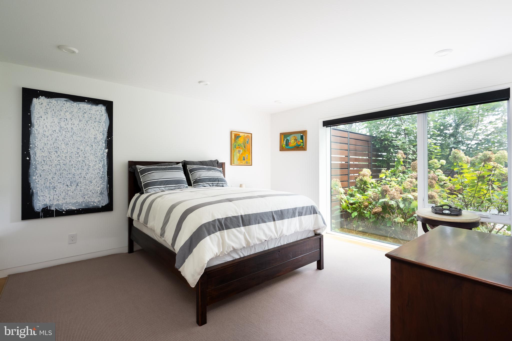 9119 Levelle Drive Chevy Chase, MD 20815 - Photo 33 of 48 a spacious bedroom with a bed and window