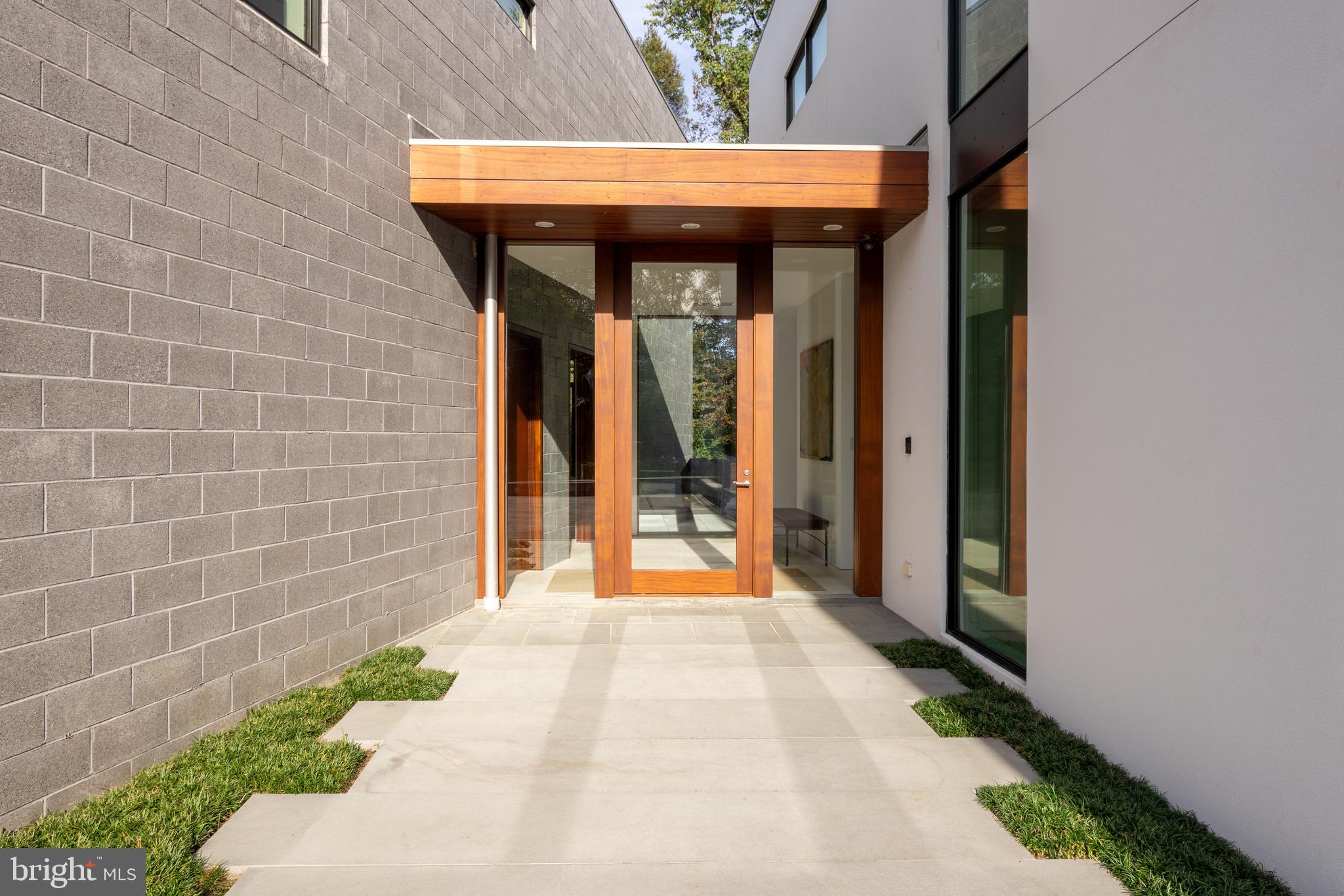 9119 Levelle Drive Chevy Chase, MD 20815 - Photo 5 of 48 Mahogany and glass pivot door