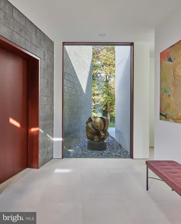 a view of a livingroom with furniture and windows