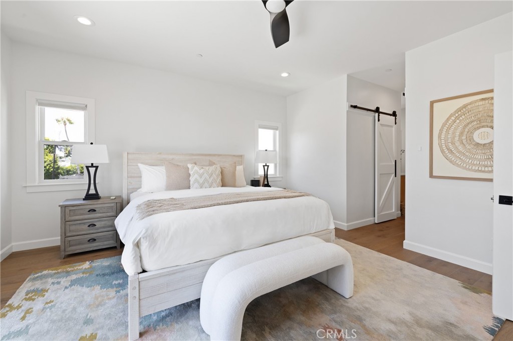 1703 South Ola Vista San Clemente, CA 92672 - Photo 12 of 45 a bedroom with a bed and wooden floor