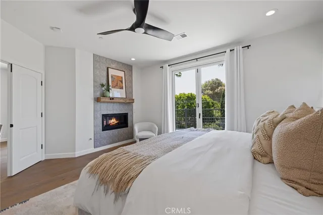 a bedroom with a bed and a fireplace