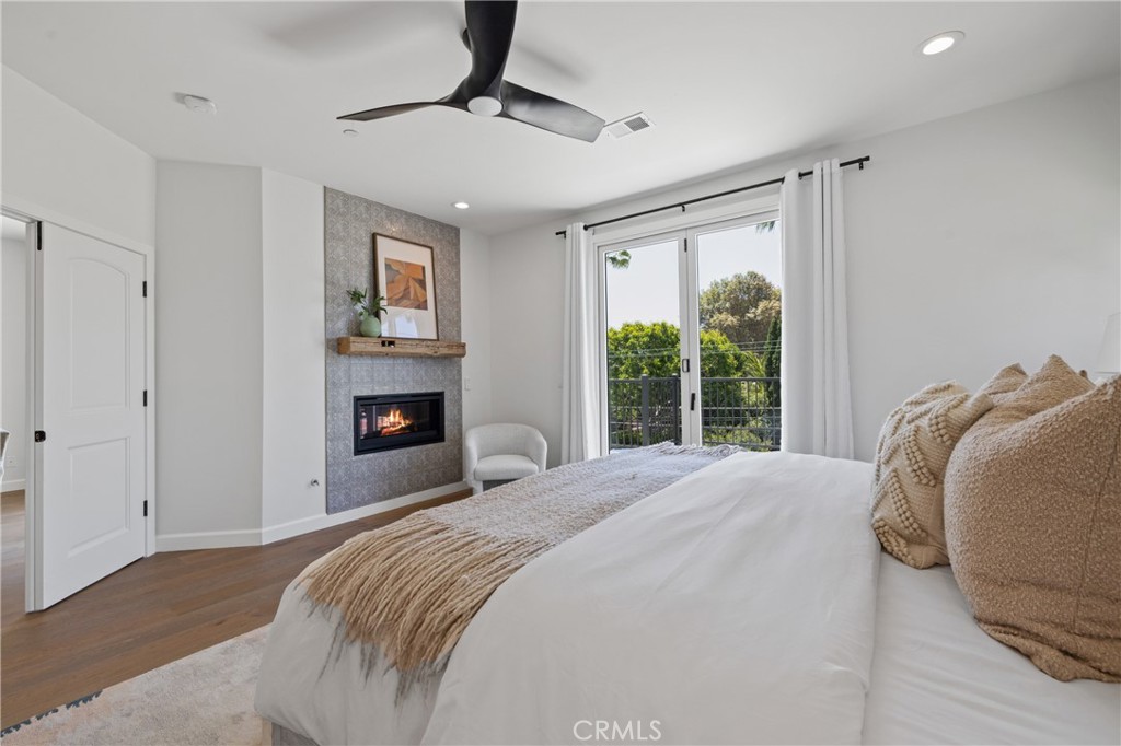 1703 South Ola Vista San Clemente, CA 92672 - Photo 13 of 45 a bedroom with a bed and a fireplace