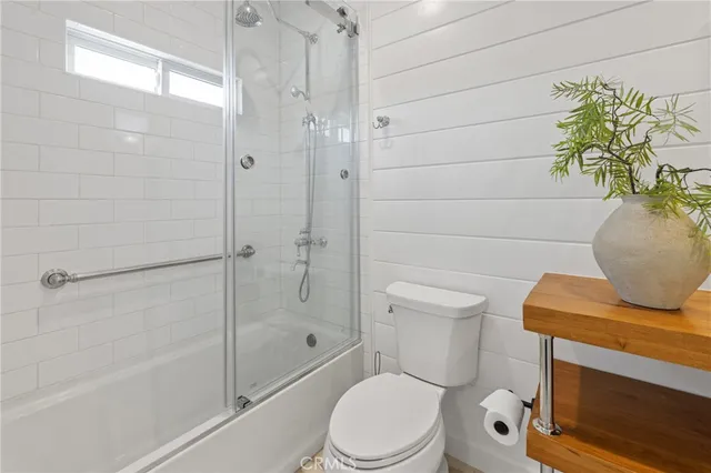 a utility room with sink dryer and washer