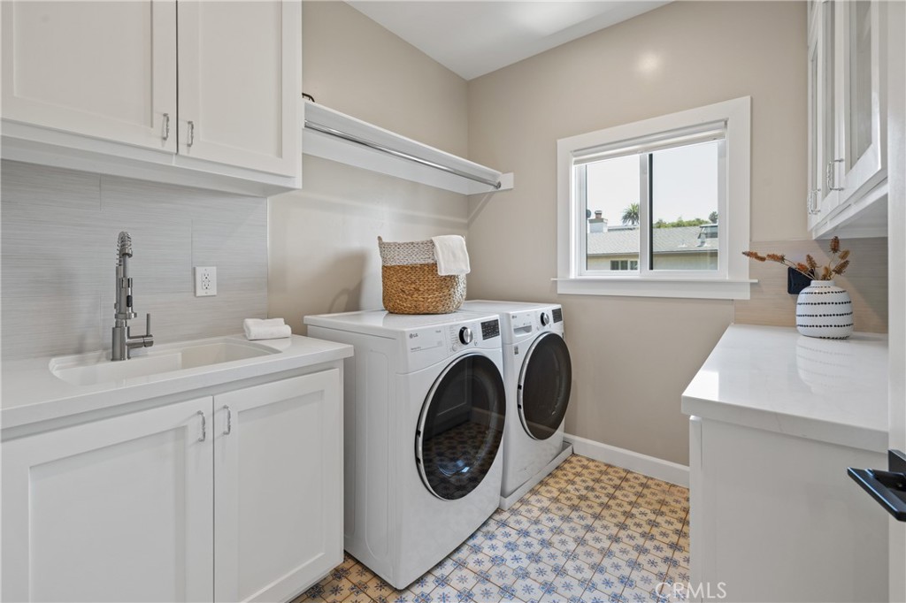 1703 South Ola Vista San Clemente, CA 92672 - Photo 26 of 45 a utility room with sink dryer and washer