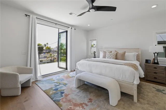 a bedroom with a bed and a couch