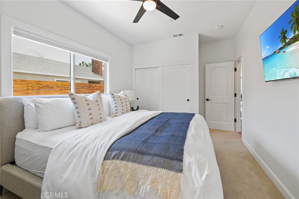 1703 South Ola Vista San Clemente, CA 92672 - Photo 31 of 45 a spacious bedroom with a bed and a large window