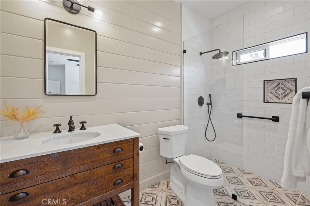 1703 South Ola Vista San Clemente, CA 92672 - Photo 32 of 45 a bathroom with a toilet sink shower and mirror