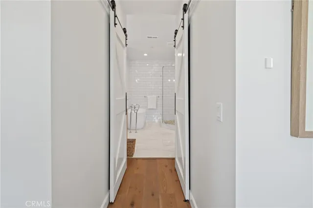 a view of a bathroom from a hallway