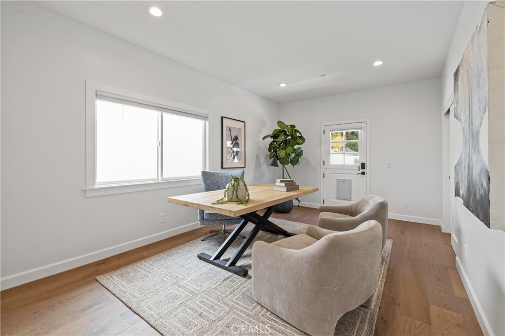 1703 South Ola Vista San Clemente, CA 92672 - Photo 34 of 45 a living room with furniture a desk and a potted plant
