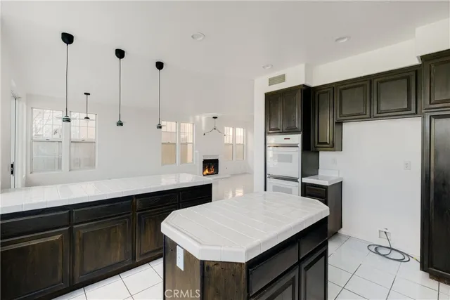 a kitchen with a sink and large window