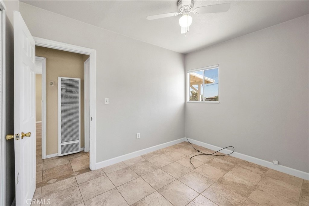 7337 Condalia Avenue Yucca Valley, CA 92284 - Photo 18 of 48 wooden floor in an empty room