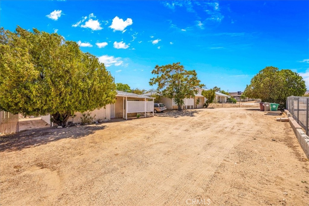 7337 Condalia Avenue Yucca Valley, CA 92284 - Photo 21 of 48 a view of a house with a yard