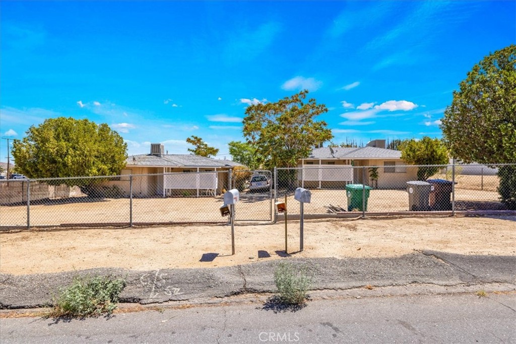 7337 Condalia Avenue Yucca Valley, CA 92284 - Photo 3 of 48 a house with a bench in front of it