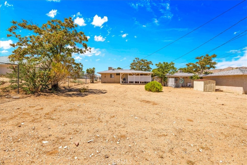 7337 Condalia Avenue Yucca Valley, CA 92284 - Photo 31 of 48 a bathroom with a sink mirror and vanity