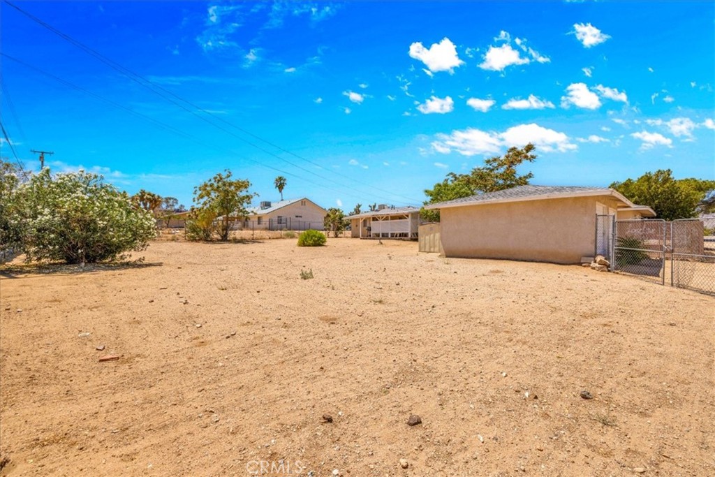 7337 Condalia Avenue Yucca Valley, CA 92284 - Photo 32 of 48 a view of a yard with snow on the road