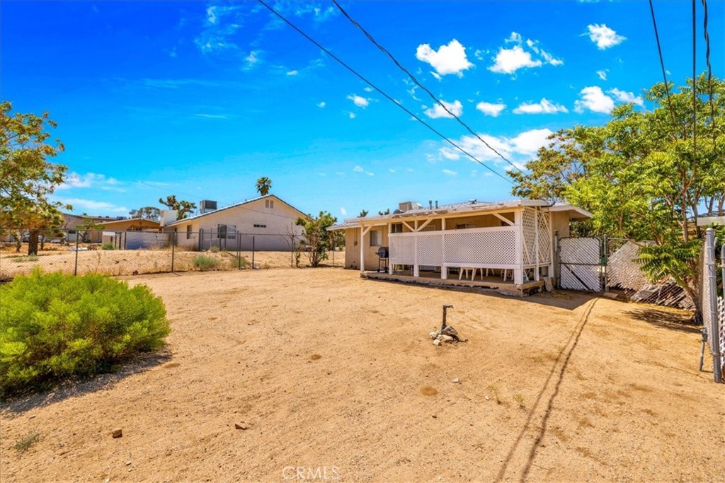 7337 Condalia Avenue Yucca Valley, CA 92284 - Photo 41 of 48 a house view with a backyard space