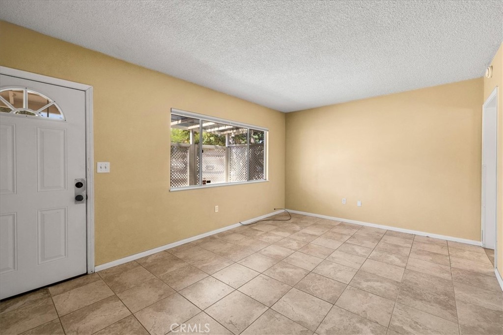 7337 Condalia Avenue Yucca Valley, CA 92284 - Photo 6 of 48 an empty room with windows